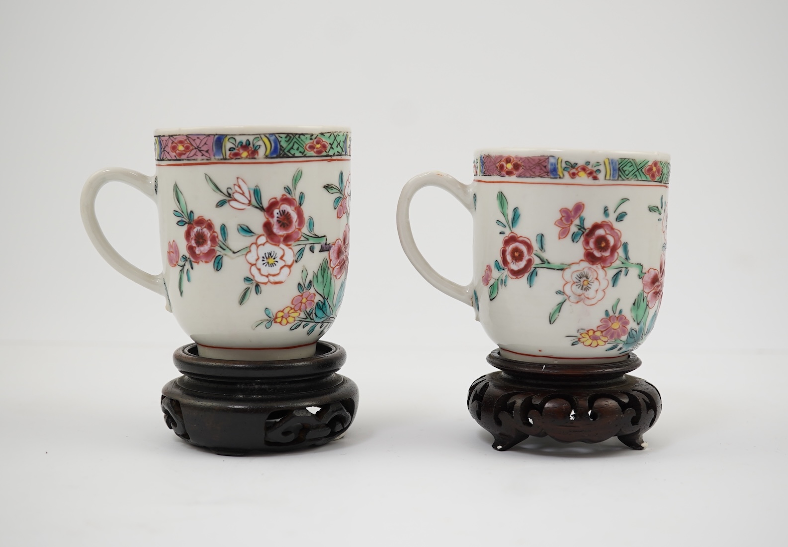 A near pair of Chinese famille rose ‘double pheasant’ coffee cups, early Qianlong period
